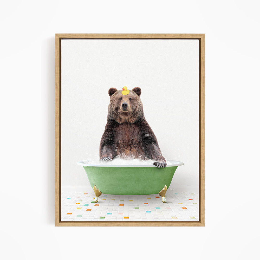 A brown bear sitting in a green bathtub filled with bubbles, wearing a yellow rubber duck hat.