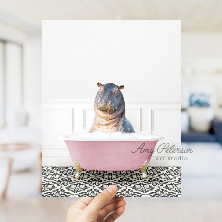 a hippo sitting in a pink bathtub with a white wall behind it