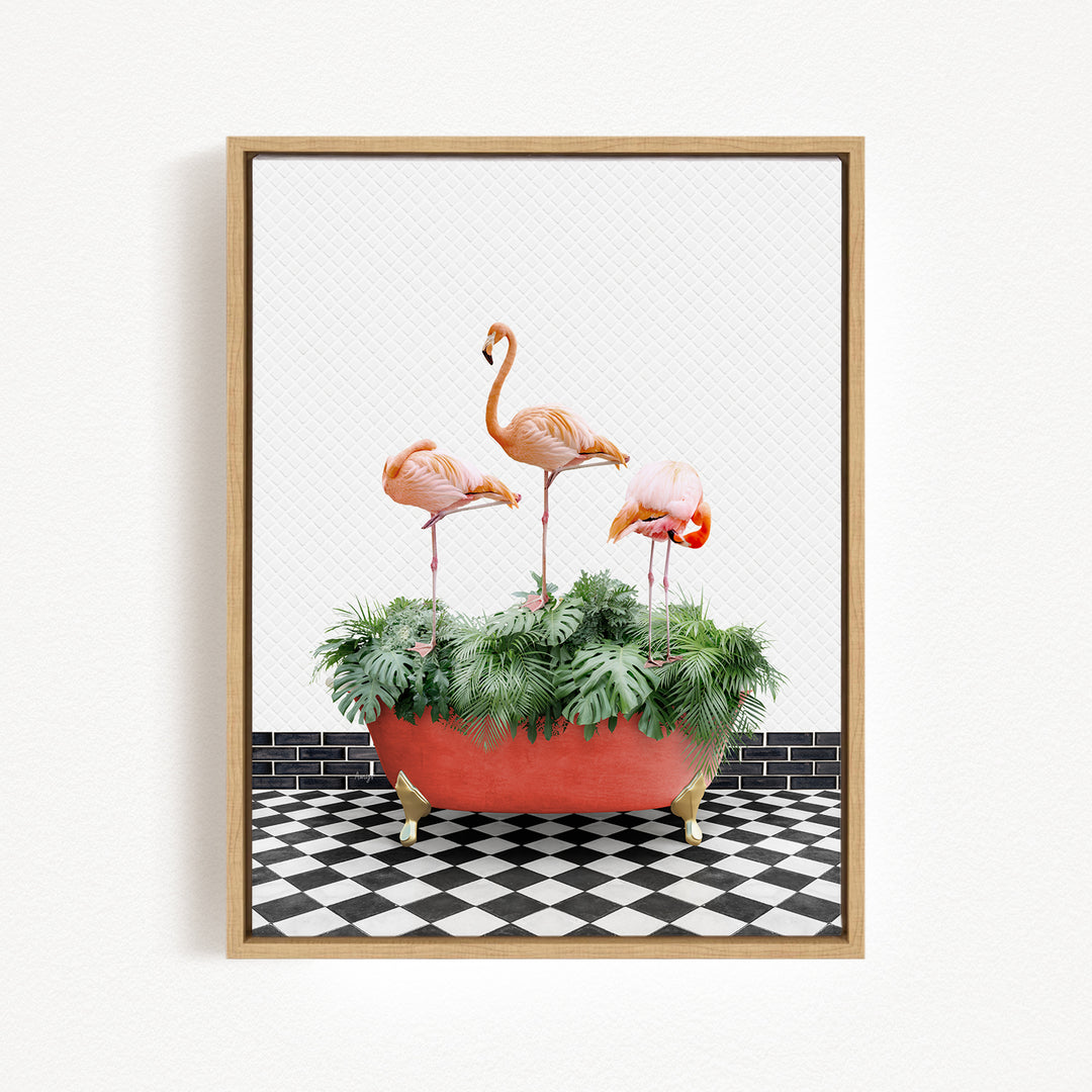 A framed image depicting three pink flamingos standing in a red bathtub filled with green plants, set against a black and white checkered floor.