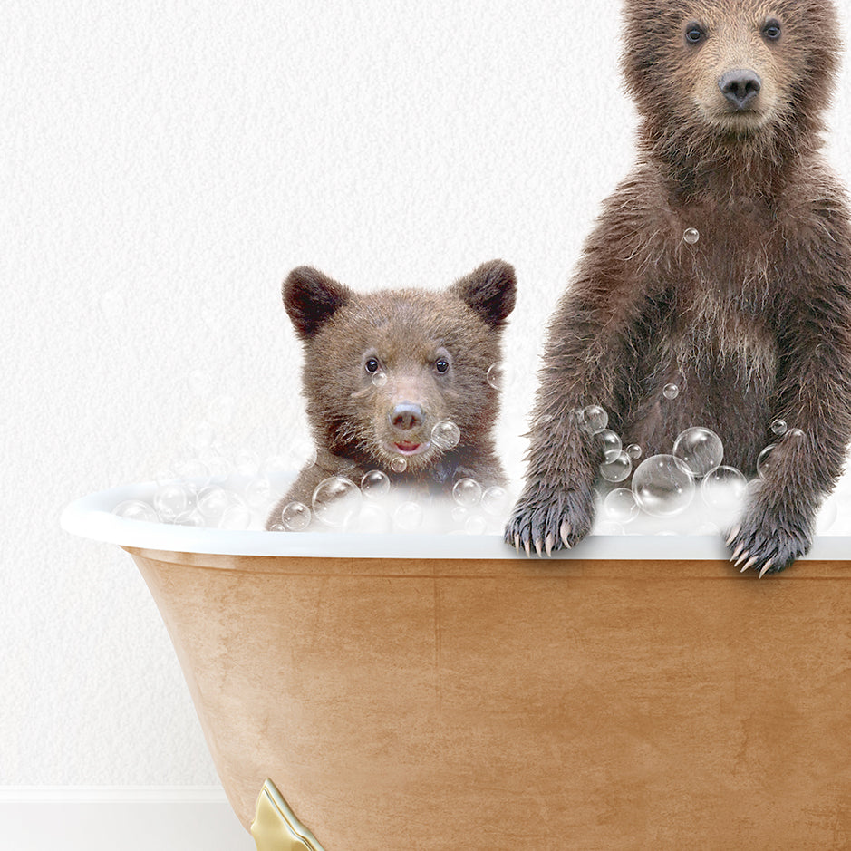 two brown bears are sitting in a bathtub