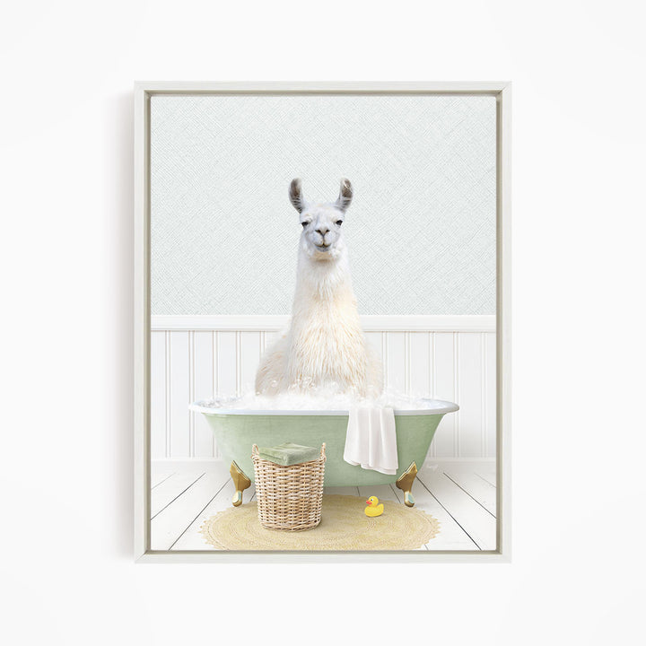 A white llama sitting in a green bathtub filled with bubbles, surrounded by a yellow rubber duck and a wicker basket.