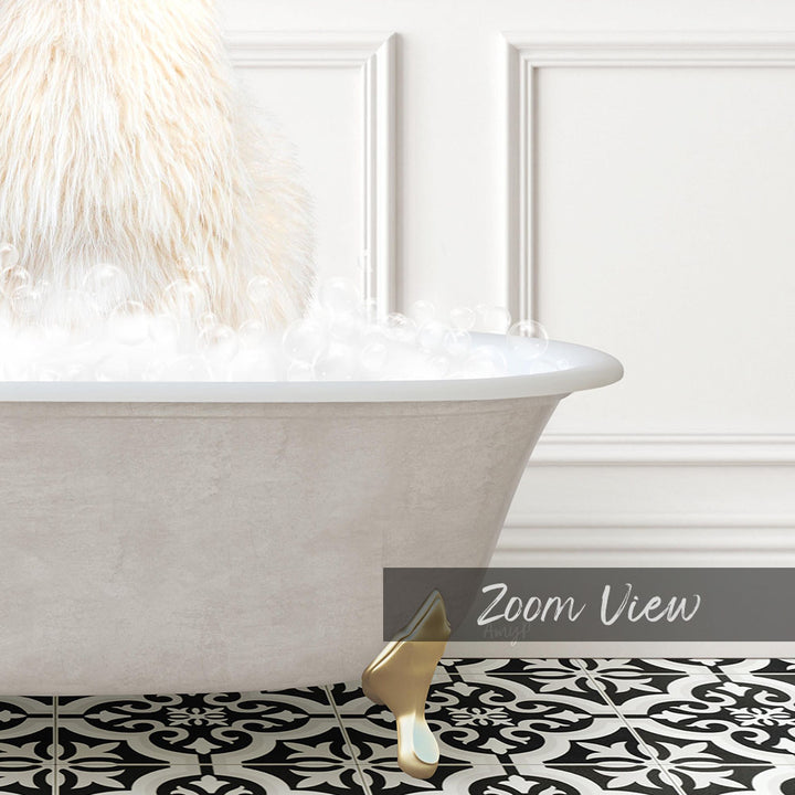 A white bathtub filled with bubbles, with a fluffy white object, possibly a cat, sitting in the tub. The bathtub is placed on a black and white patterned floor.