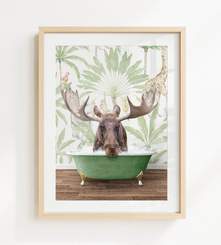 A moose is sitting in a green bathtub, surrounded by tropical foliage and a giraffe in the background.