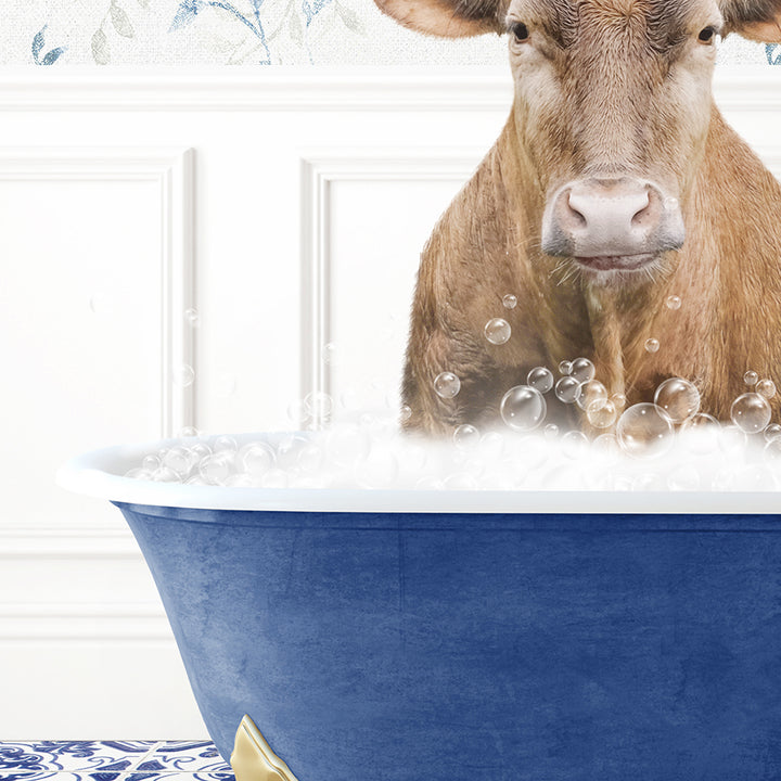 a brown cow sitting in a blue bath tub filled with bubbles