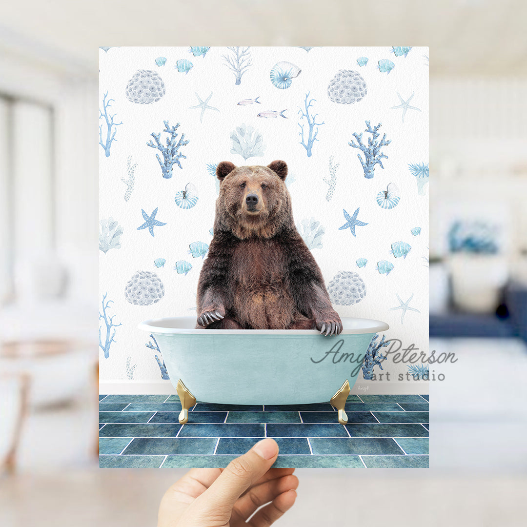 a person holding up a card with a bear in a bathtub