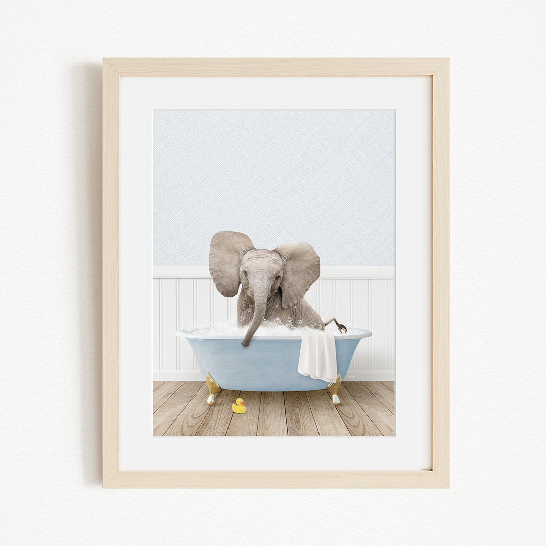 A baby elephant sitting in a blue bathtub filled with water, surrounded by yellow rubber duckies.