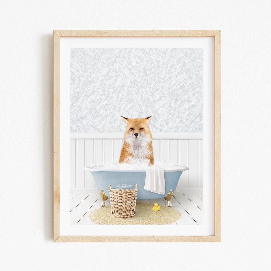 A red fox is sitting in a blue bathtub filled with water, surrounded by rubber ducks and a white towel.