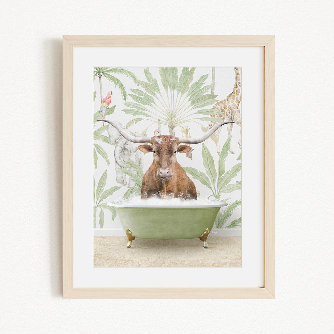 A framed image depicting a brown cow sitting in a green bathtub, surrounded by tropical foliage and a giraffe.
