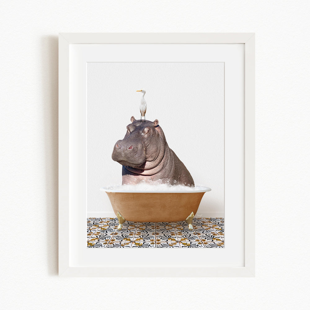 A framed image depicting a large hippopotamus sitting in a bathtub, with a seagull perched on its head.