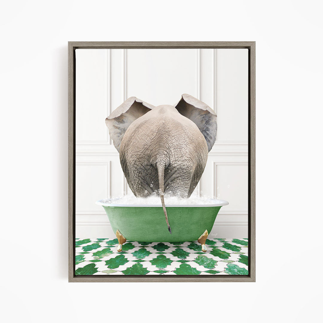 An elephant is sitting in a green bathtub filled with water, with its trunk submerged in the water.
