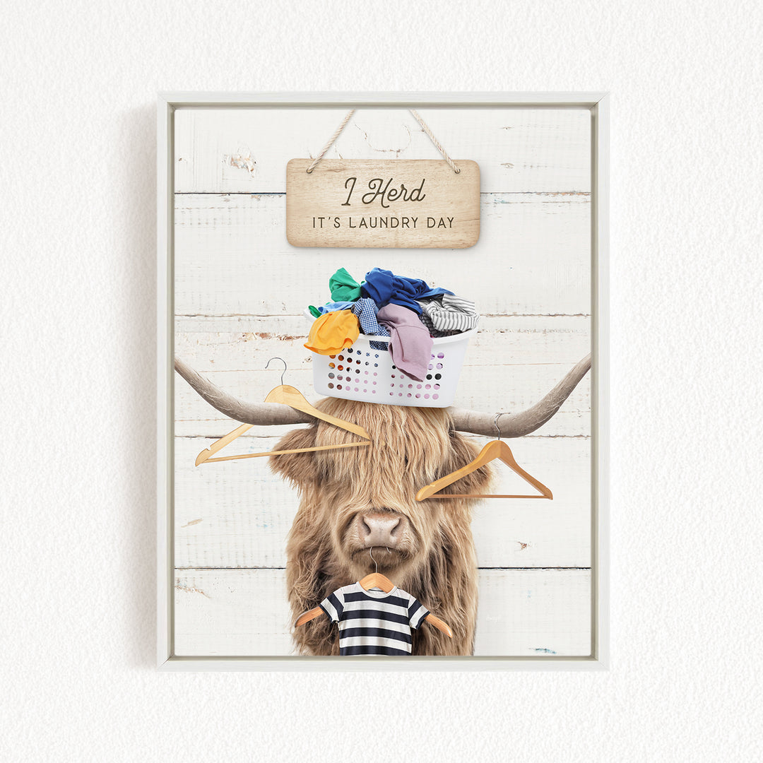 A humorous collage featuring a cow with a basket of laundry on its head, accompanied by a sign that reads "I herd it's laundry day".