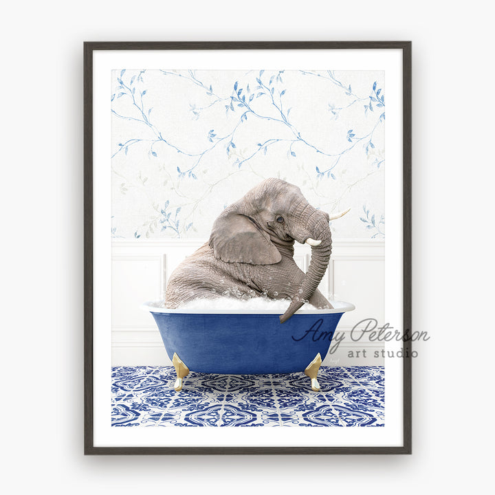 a baby elephant sitting in a blue bath tub