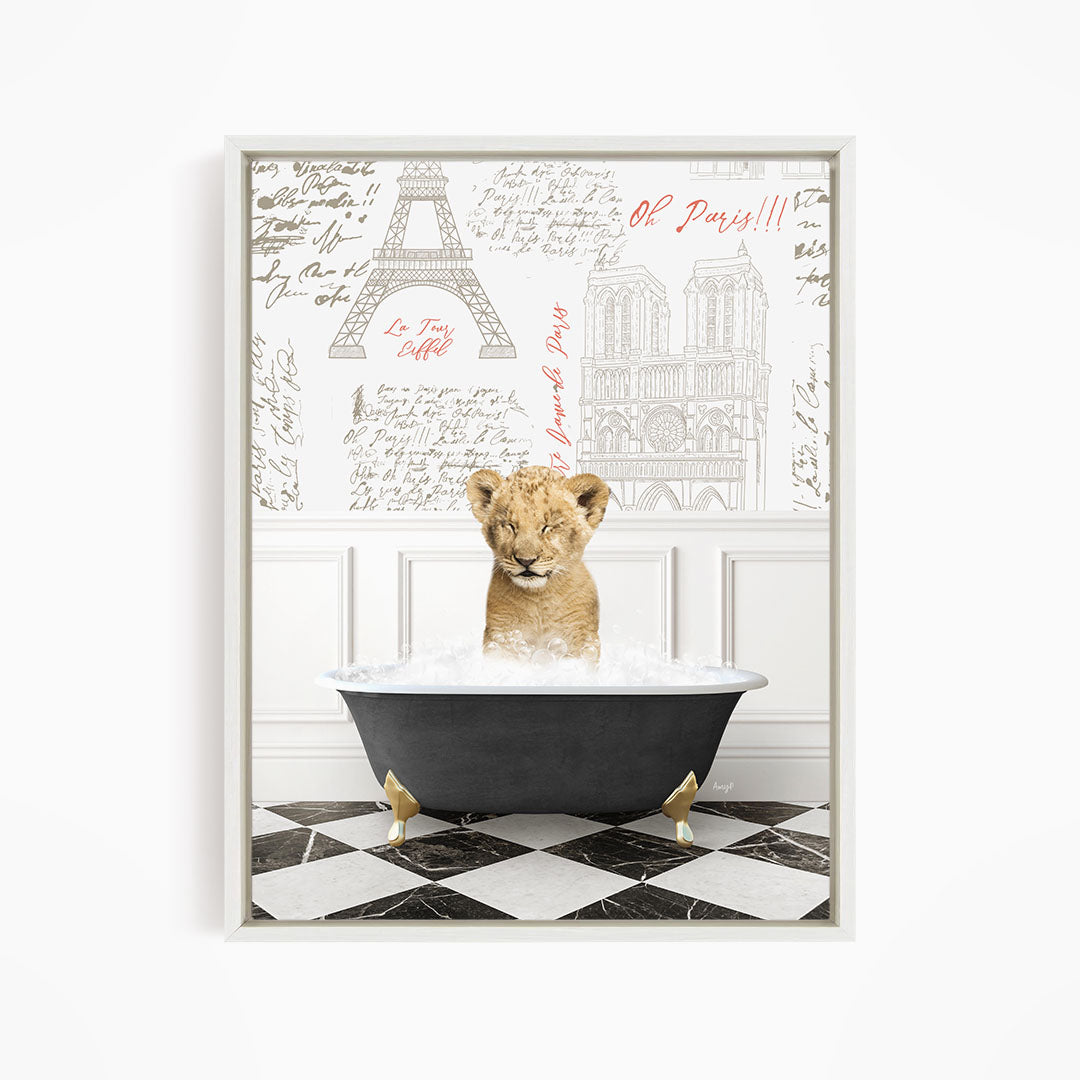 A young lion cub sitting in a bathtub filled with water, surrounded by a Paris-themed background with the Eiffel Tower and other landmarks.