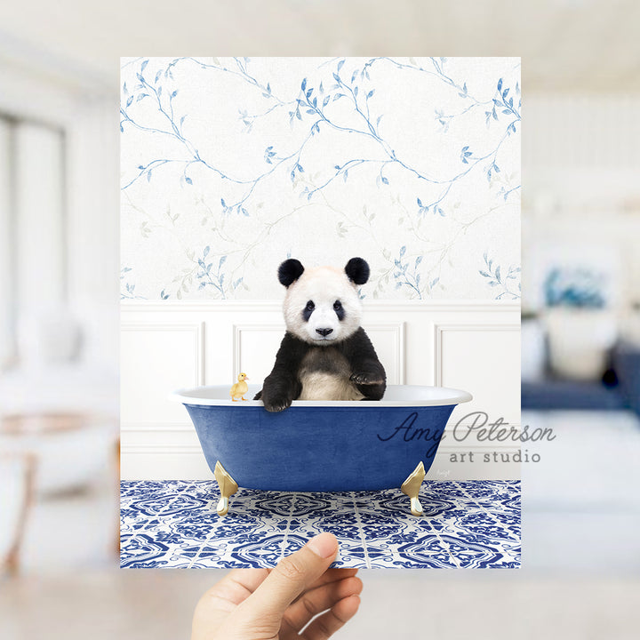 a panda bear sitting in a blue bath tub