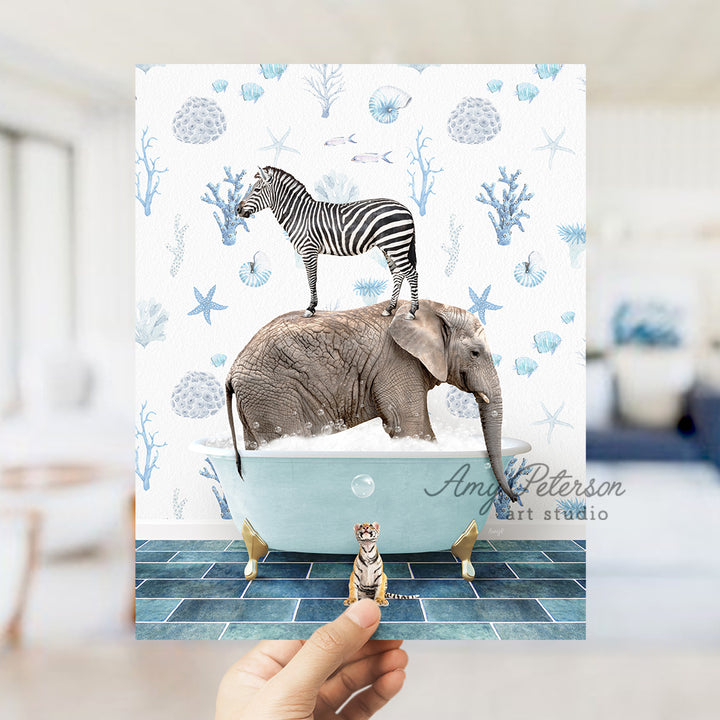 a person holding up a card with a picture of a zebra and an elephant on