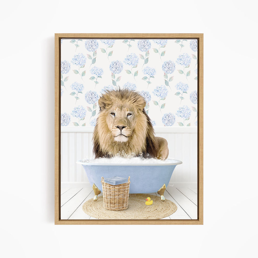 A lion is sitting in a blue bathtub filled with water, surrounded by a wicker basket and rubber ducks.