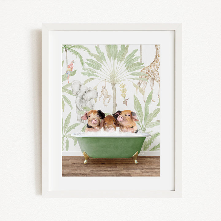 A framed print depicting three pigs sitting in a green bathtub, surrounded by a tropical jungle wallpaper.