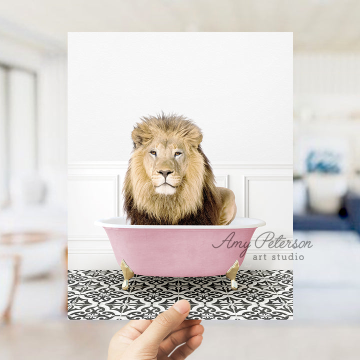 a lion sitting in a pink bath tub