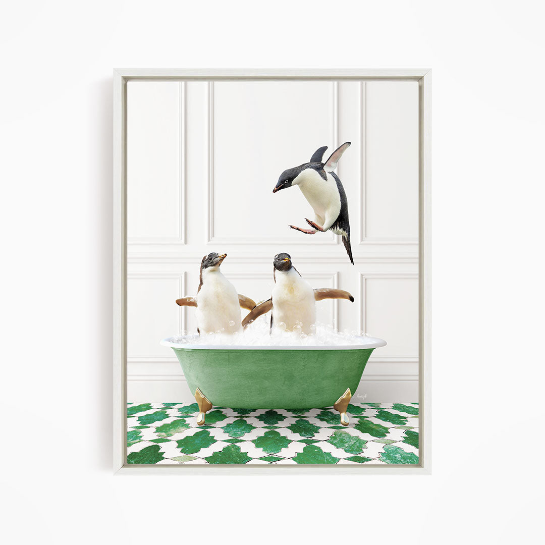 A framed image depicting two penguins sitting in a green bathtub, with one penguin flying towards the other in mid-air.