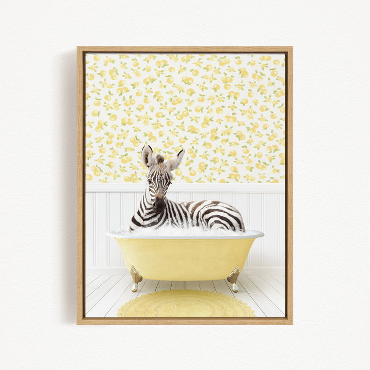 A zebra is sitting in a yellow bathtub, surrounded by a yellow and white floral pattern on the wall behind it.