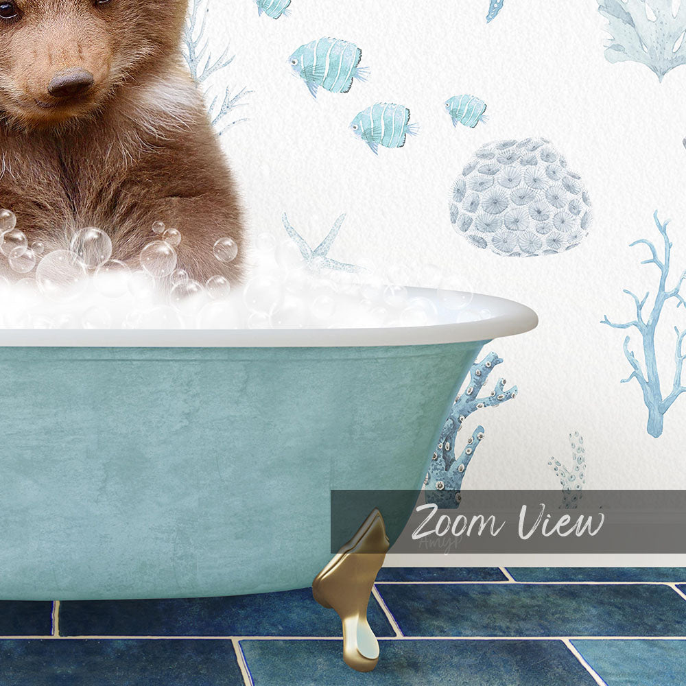 A brown bear is sitting in a blue bathtub filled with bubbles, surrounded by a blue and white underwater scene with fish and coral.
