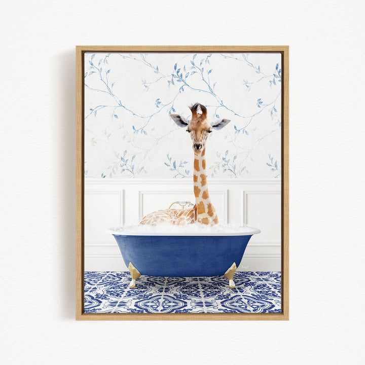 A giraffe sitting in a blue bathtub, surrounded by a patterned blue and white rug.
