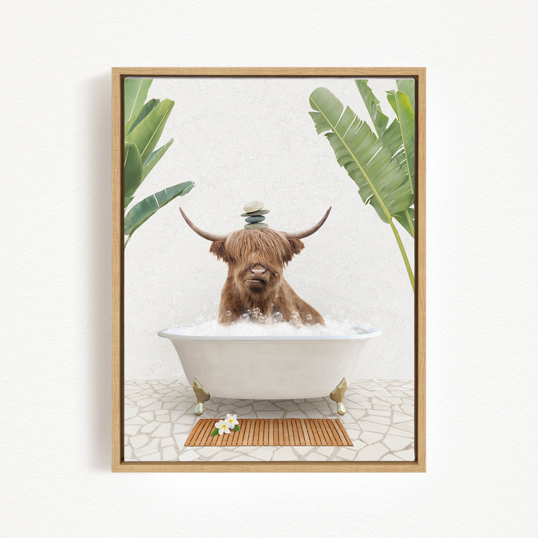 A brown cow with long horns is sitting in a white bathtub filled with water, surrounded by green plants and a wooden mat on the floor.