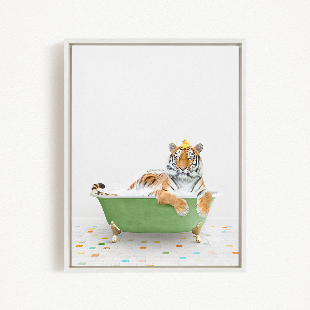 A tiger is sitting in a green bathtub, wearing a crown and looking directly at the camera.