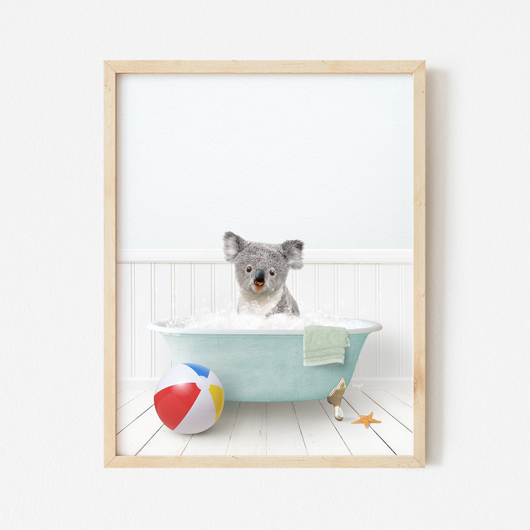 a picture of a koala in a bathtub with a beach ball