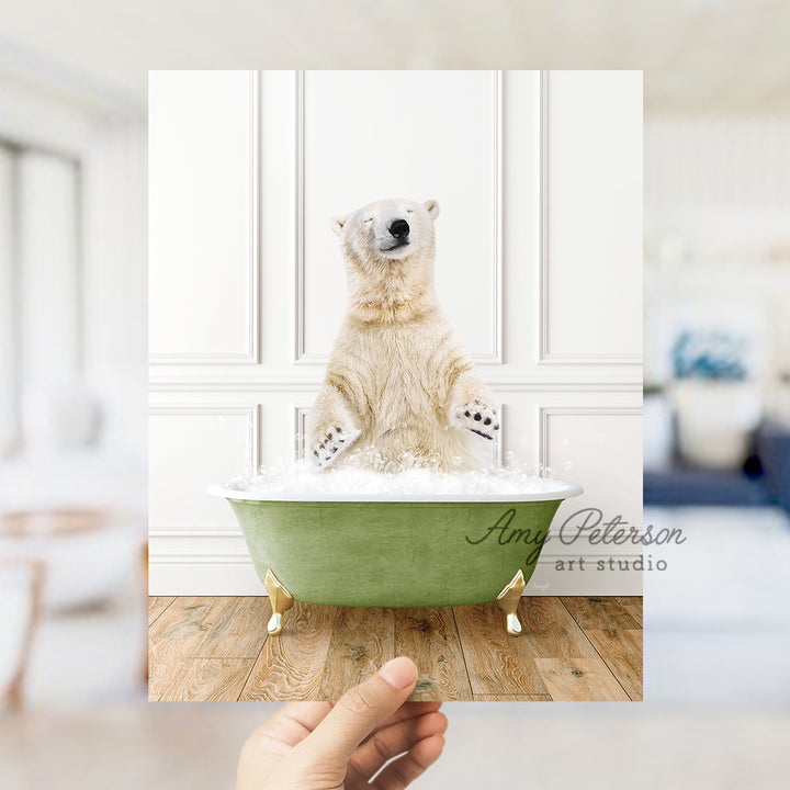 a polar bear sitting in a green bath tub