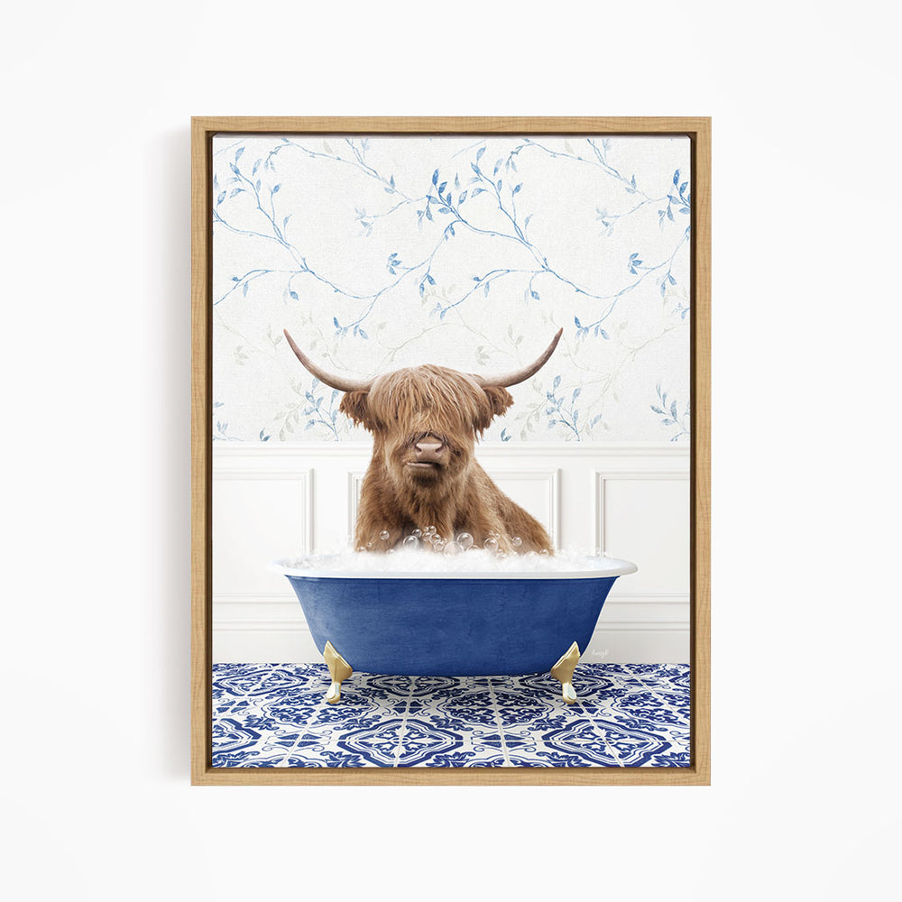 A brown cow with long horns is sitting in a blue bathtub, surrounded by a blue and white patterned rug and a floral wallpaper background.
