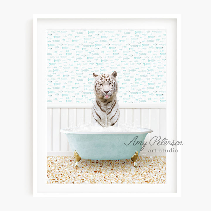 a white tiger sitting in a bath tub