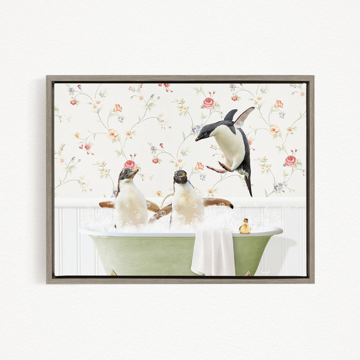 A framed image depicting three penguins sitting in a green bathtub, with one penguin flying towards the others.
