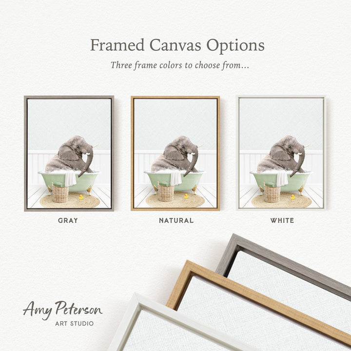 The image is a framed canvas option showcasing three different frame colors: gray, natural, and white. The canvas features a gray elephant sitting in a bathtub, with a basket nearby.