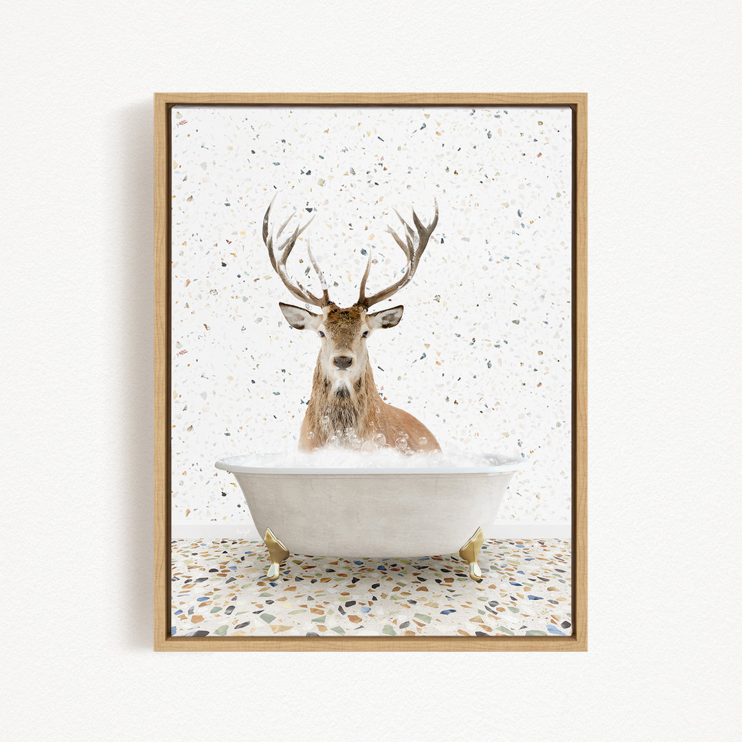 A deer with large antlers is sitting in a white bathtub filled with water, surrounded by a speckled pattern on the floor.