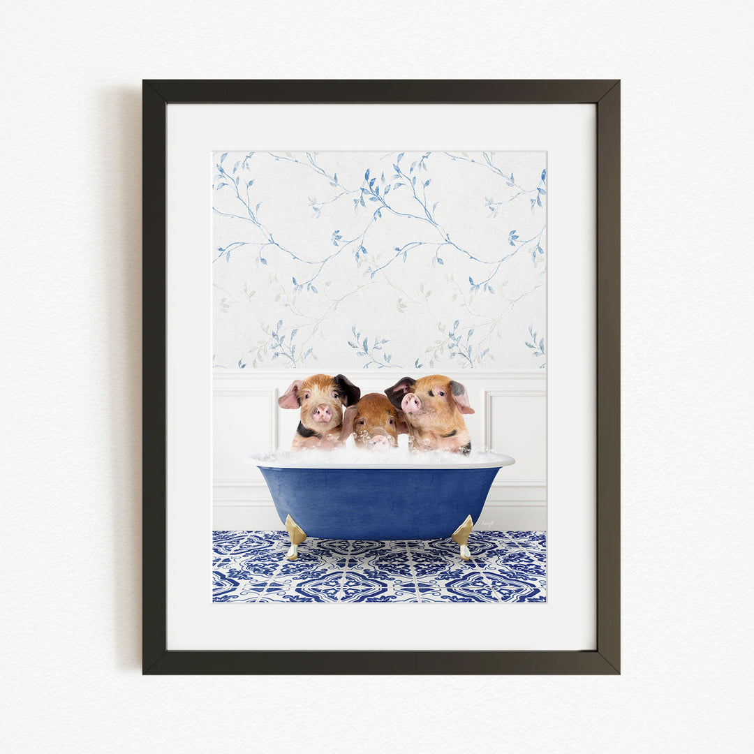 Three adorable pigs sitting in a blue bathtub, with a floral patterned wall behind them.