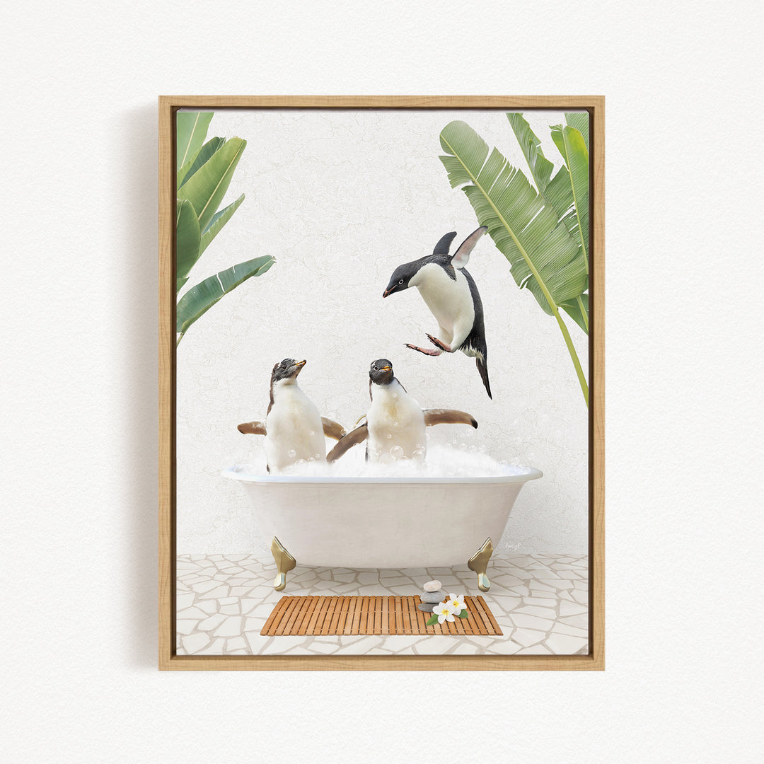 A framed image depicting three penguins sitting in a bathtub, surrounded by tropical plants.