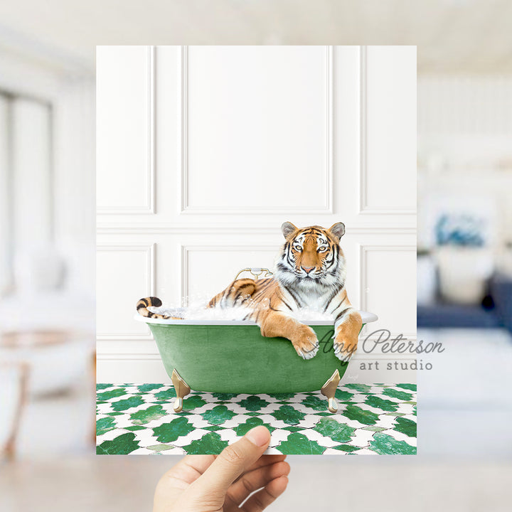 a hand holding a card with a picture of a tiger in a bathtub