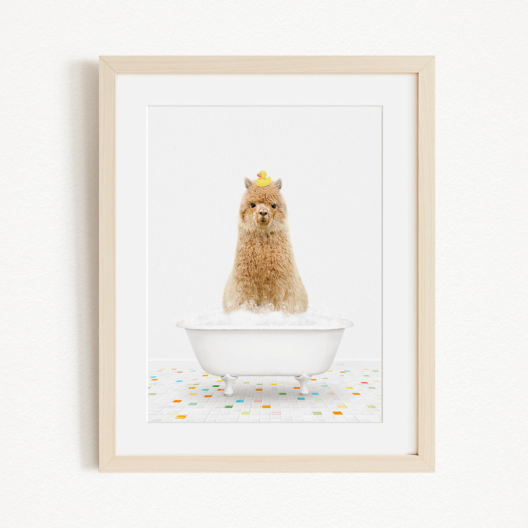 A fluffy brown dog sitting in a white bathtub filled with bubbles, wearing a yellow hat.