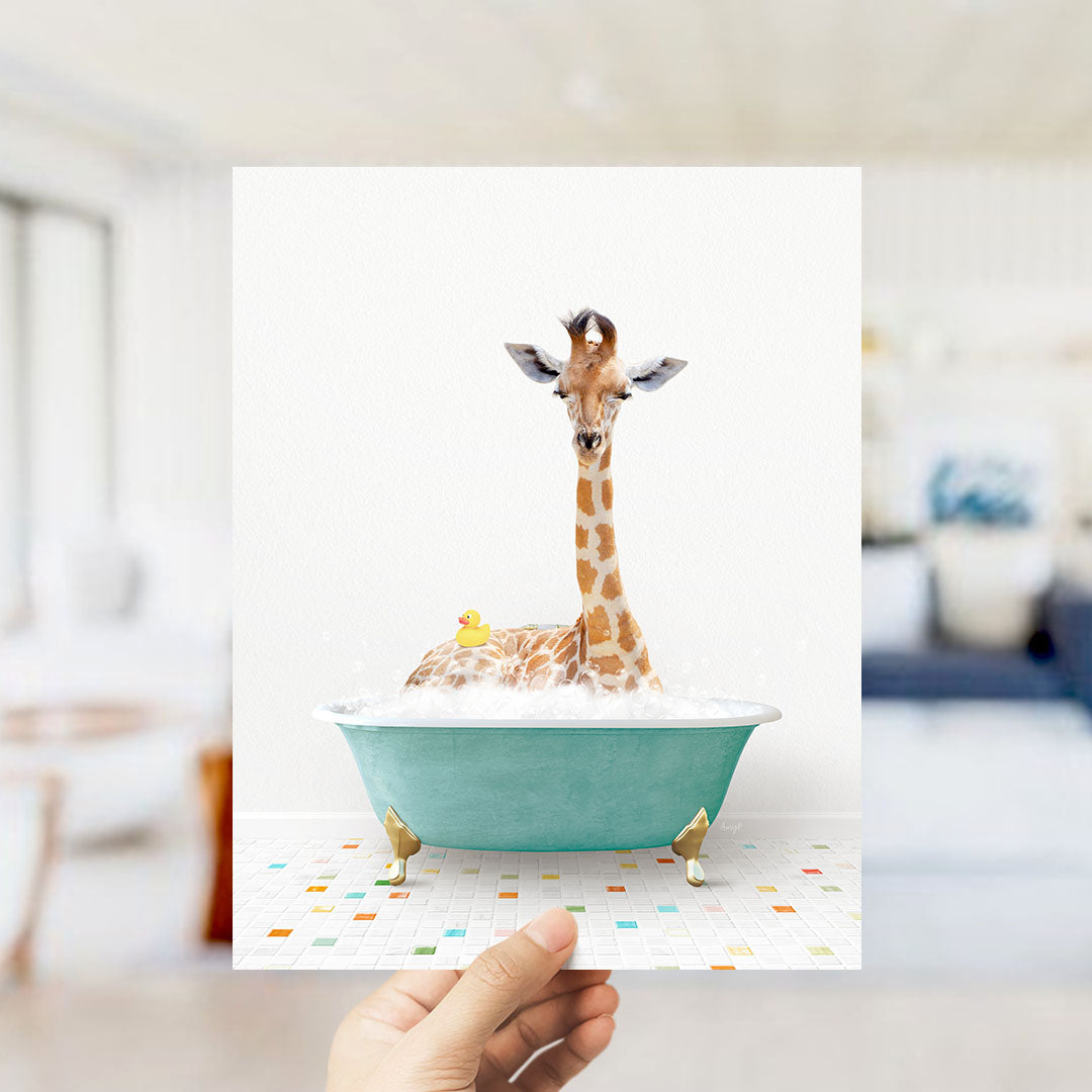 A giraffe sitting in a bathtub filled with bubbles, with a rubber duck floating nearby.
