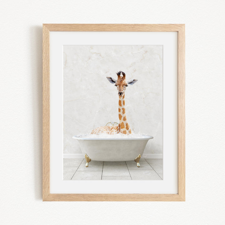 A giraffe is sitting in a white bathtub filled with bubbles, creating a whimsical and playful scene.