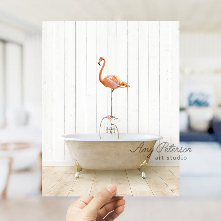 a pink flamingo standing on a bathtub in a white room