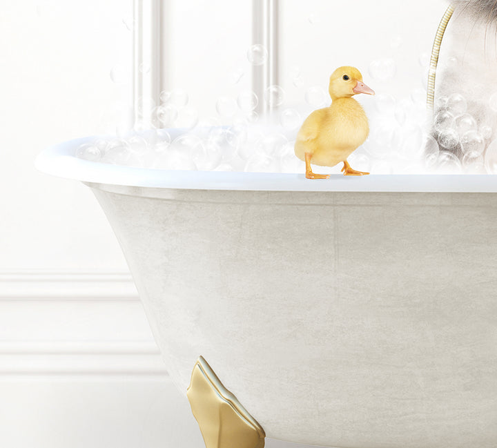 a rubber ducky sitting in a bathtub filled with bubbles