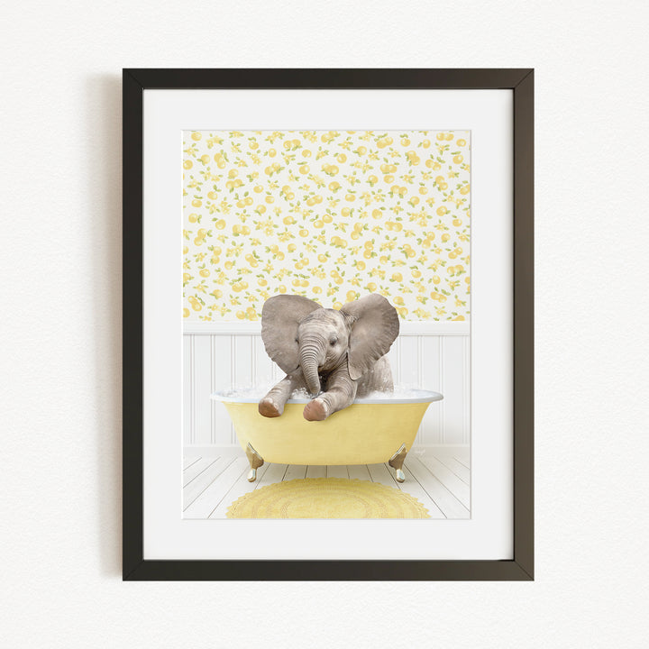 A baby elephant sitting in a yellow bathtub, surrounded by a yellow floral wallpaper.
