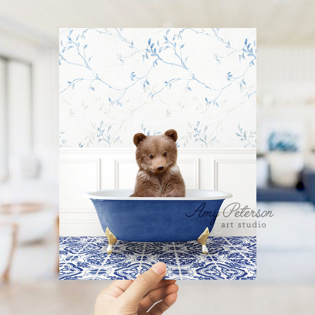 a person holding up a card with a picture of a bear in a bathtub