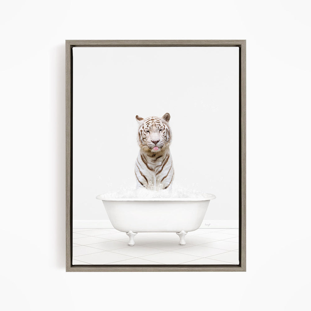 A white tiger sitting in a white bathtub filled with water.