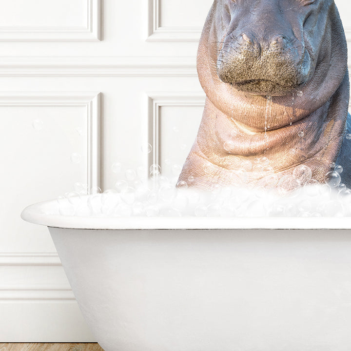 a hippopotamus sitting in a bathtub full of foam