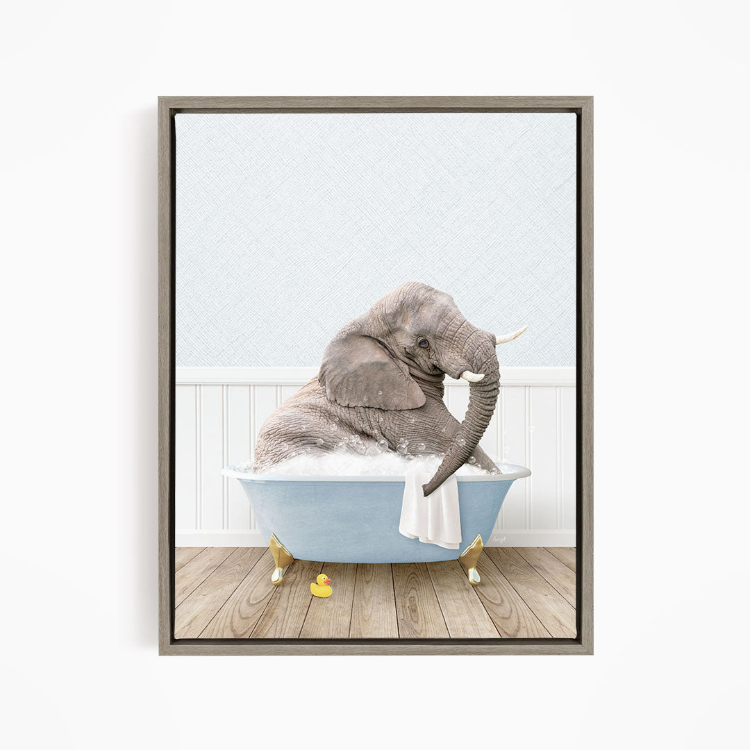 A gray elephant is sitting in a blue bathtub filled with water, surrounded by yellow rubber ducks.