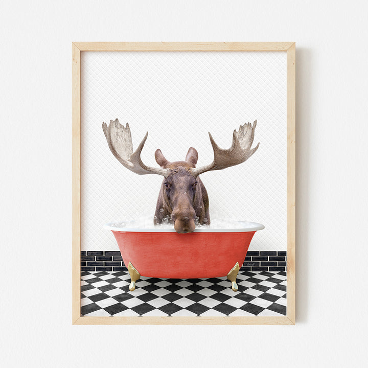 a moose is taking a bath in a red bathtub