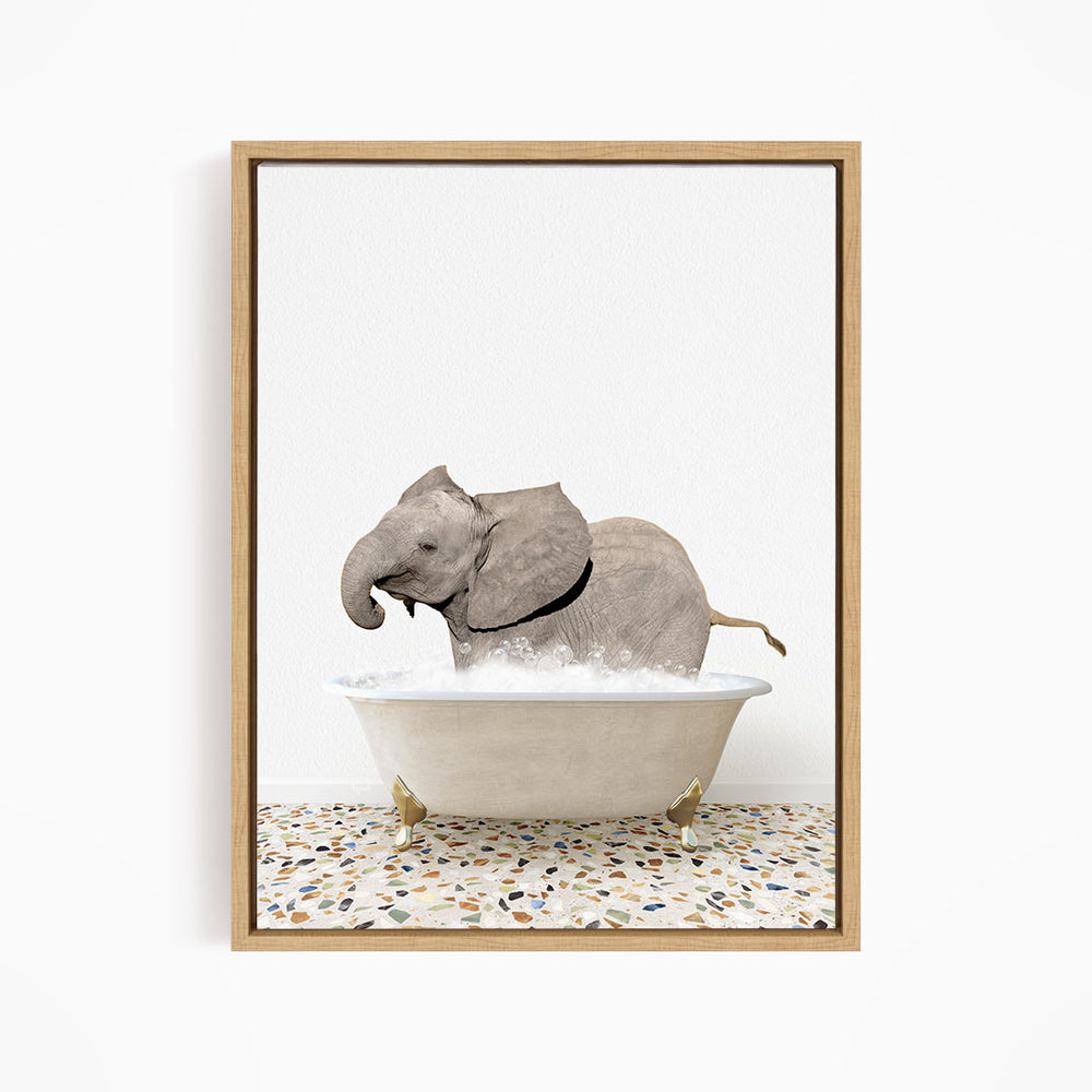 A gray elephant is sitting in a white bathtub filled with water, creating a whimsical and playful scene.